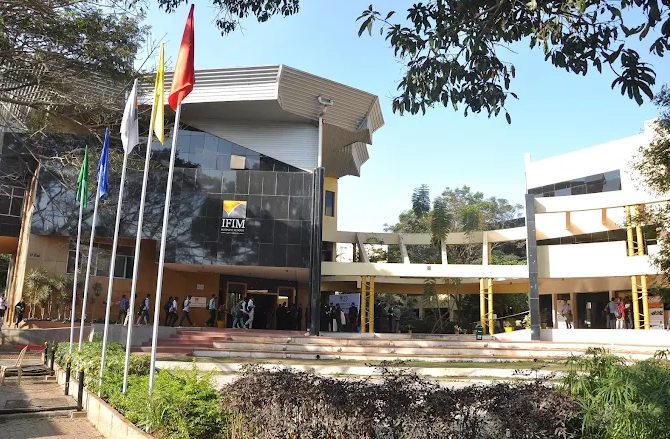  Corporate leader delivering a guest lecture to students at Jagdish Sheth School of Management Bangalore